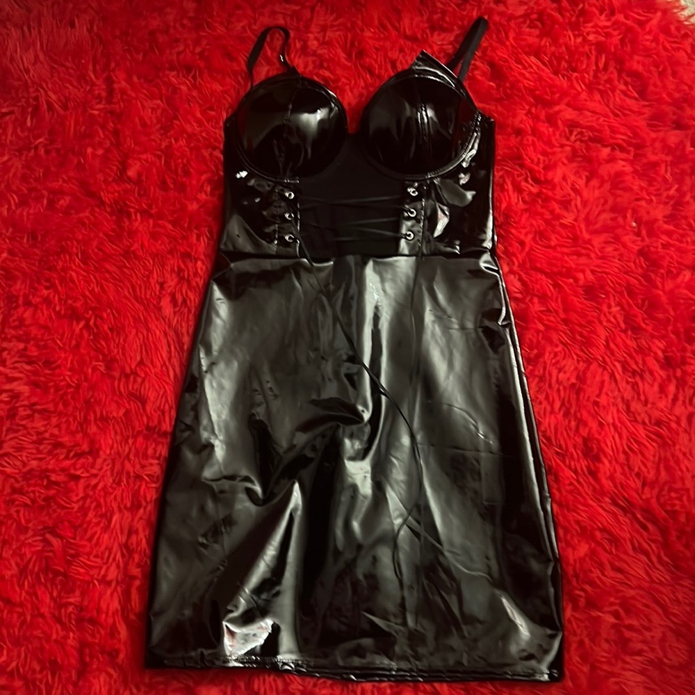 Black vynal dress with a corset front. Nearly brand new condition. Is a size 4-6